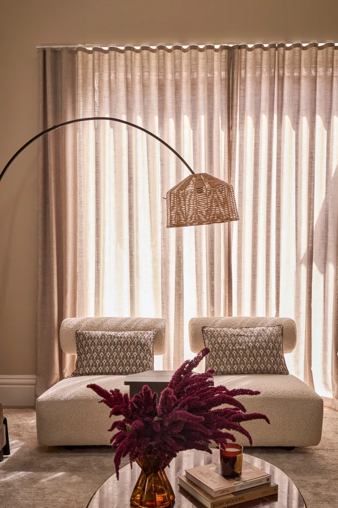 Steph and Gian's living room armchairs against sheer curtains
