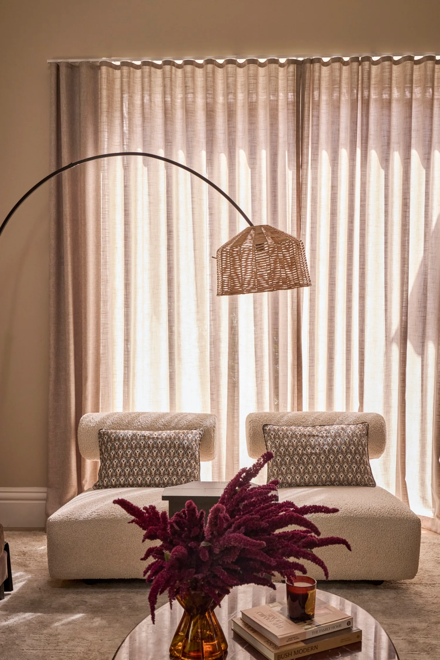 Steph and Gian's living room armchairs against sheer curtains