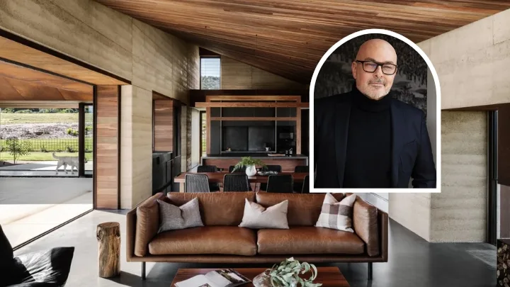 A large living area with polished concrete floors and underfloor heating with a portrait of Neale Whitaker inset
