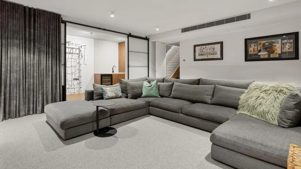 James Pattinson and wife Kayla's Black Rock home basement lounge area