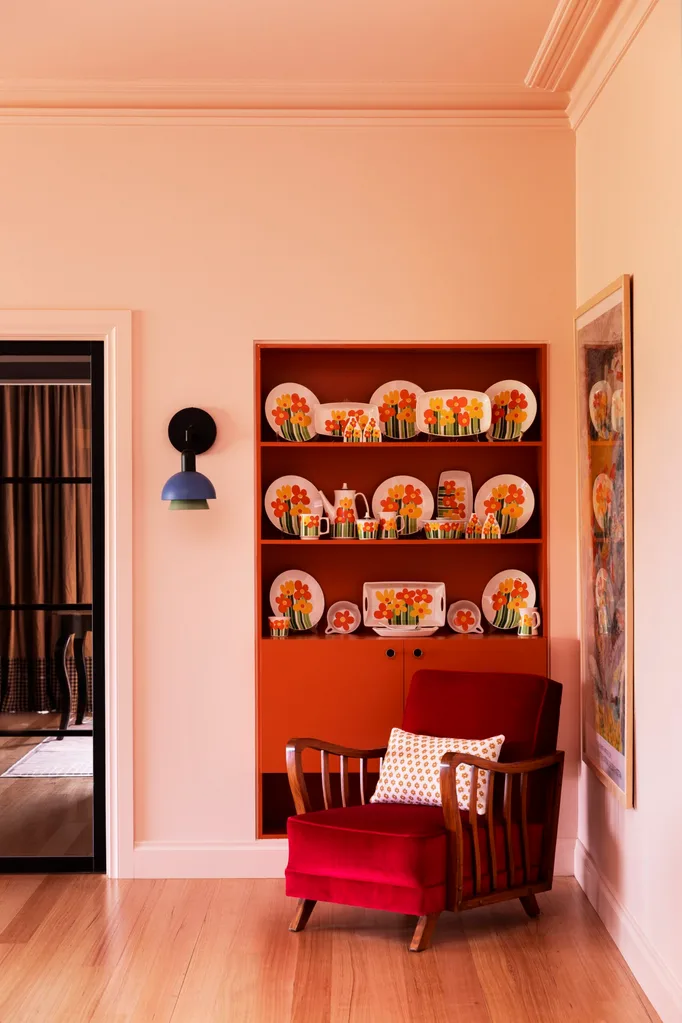 Yarra Valley home interior designer Carolyn Burns-McCrave red occasional chair colourful china shelf
