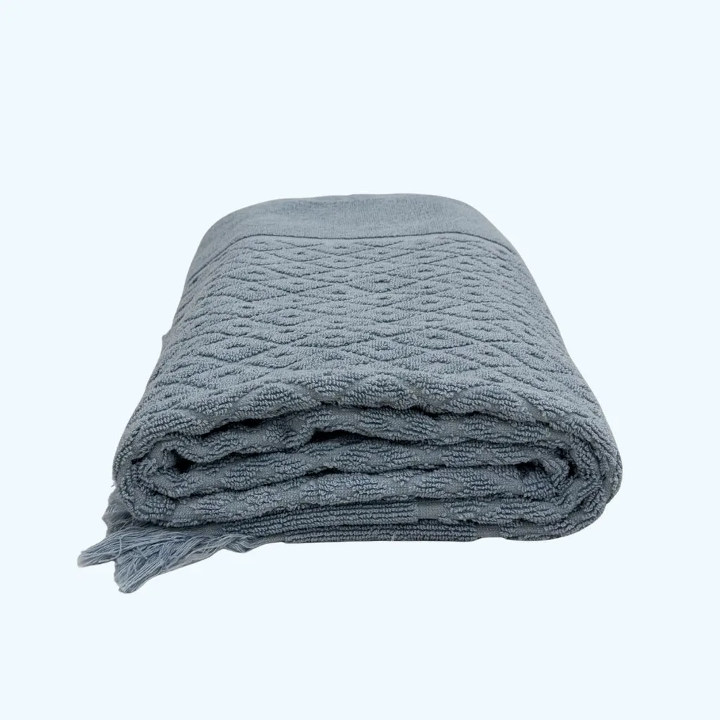 a blue towel folded into a rectangle shape
