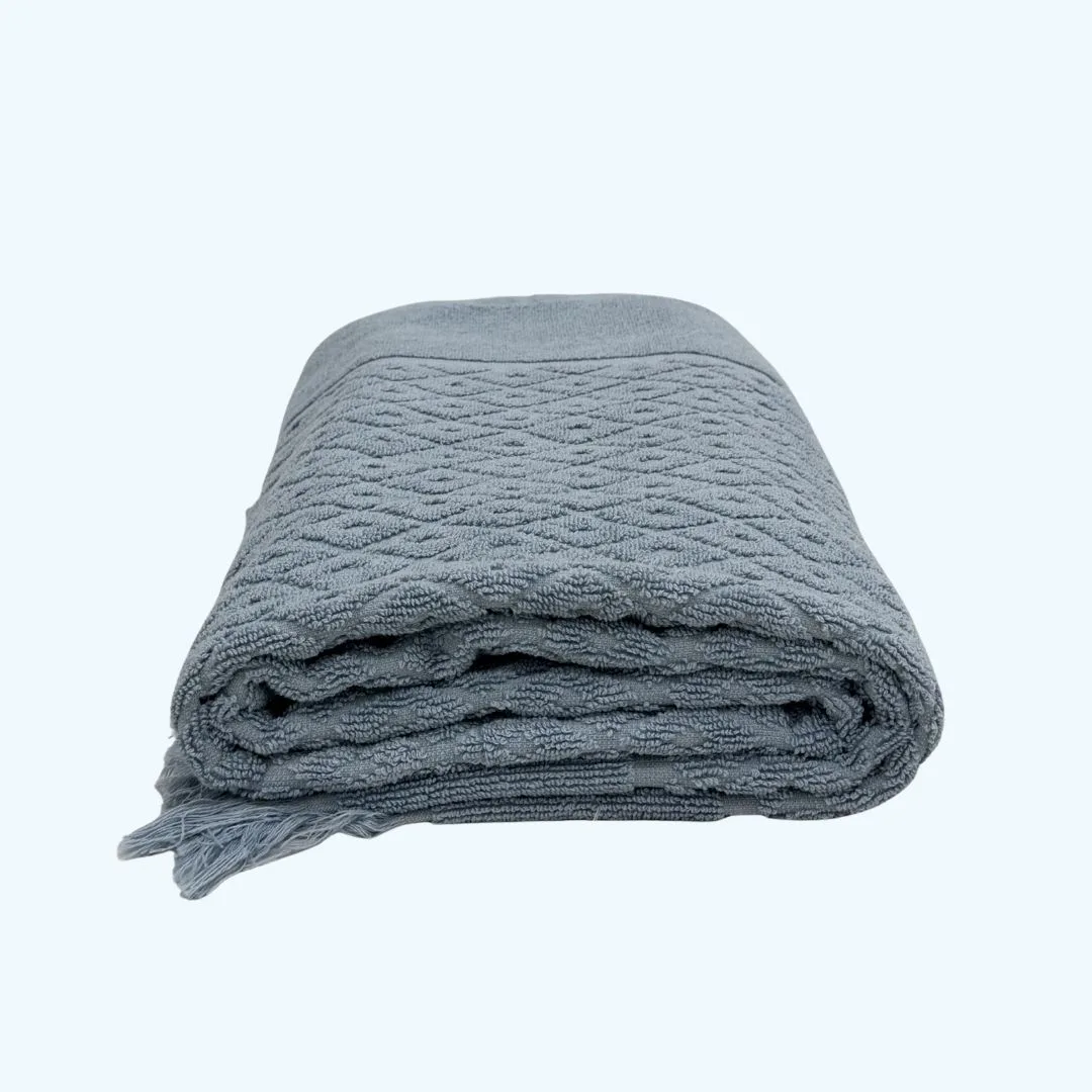 a blue towel folded into a rectangle shape