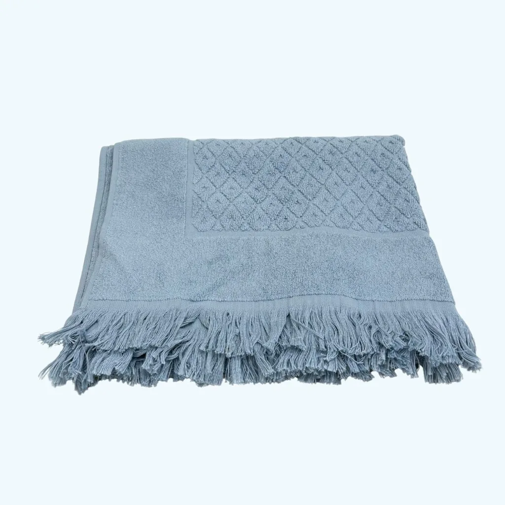 a grey-blue towel folded into a neat square