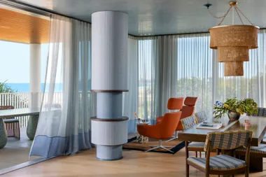 Carlene Duffy Gold Coast apartment Surf Shack living and dining blue orange walnut large pendant drapes