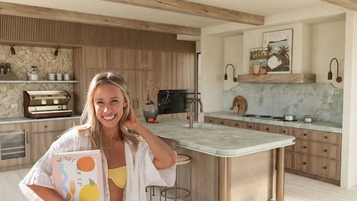 Sarah next to render of kitchen
