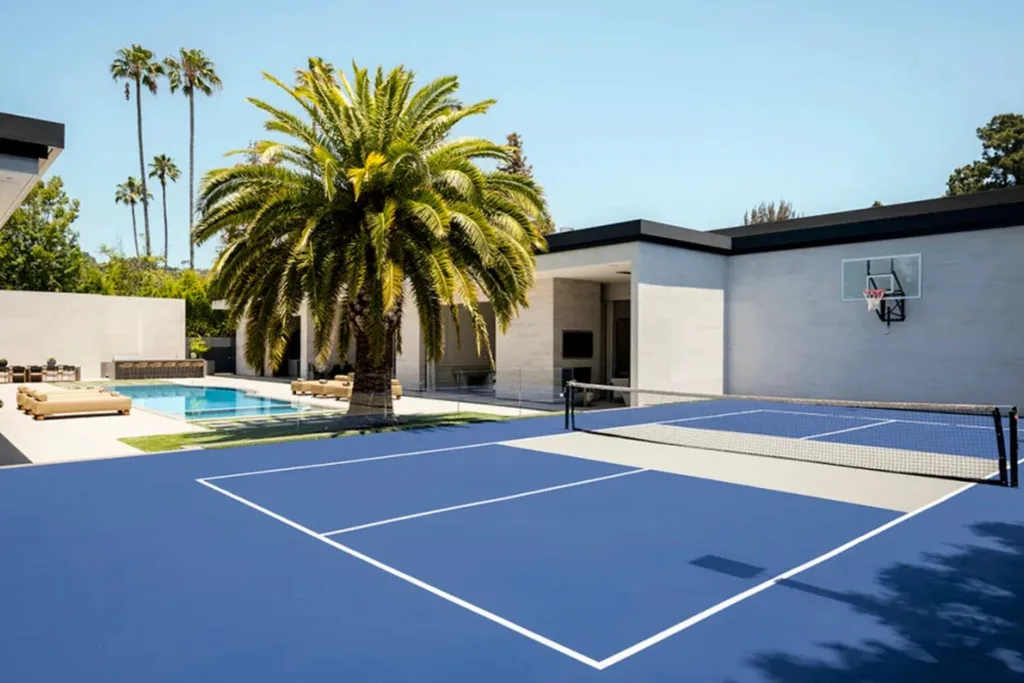Private pickleball and basketball court beside the swimming pool at Kylie Jenner’s Holmby Hills mansion.