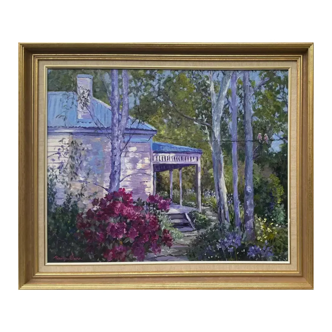 A painting of a charming Australian Villa nestled in a forest of gum trees and hydrangeas by Marilyn Dann in a gold ornate frame