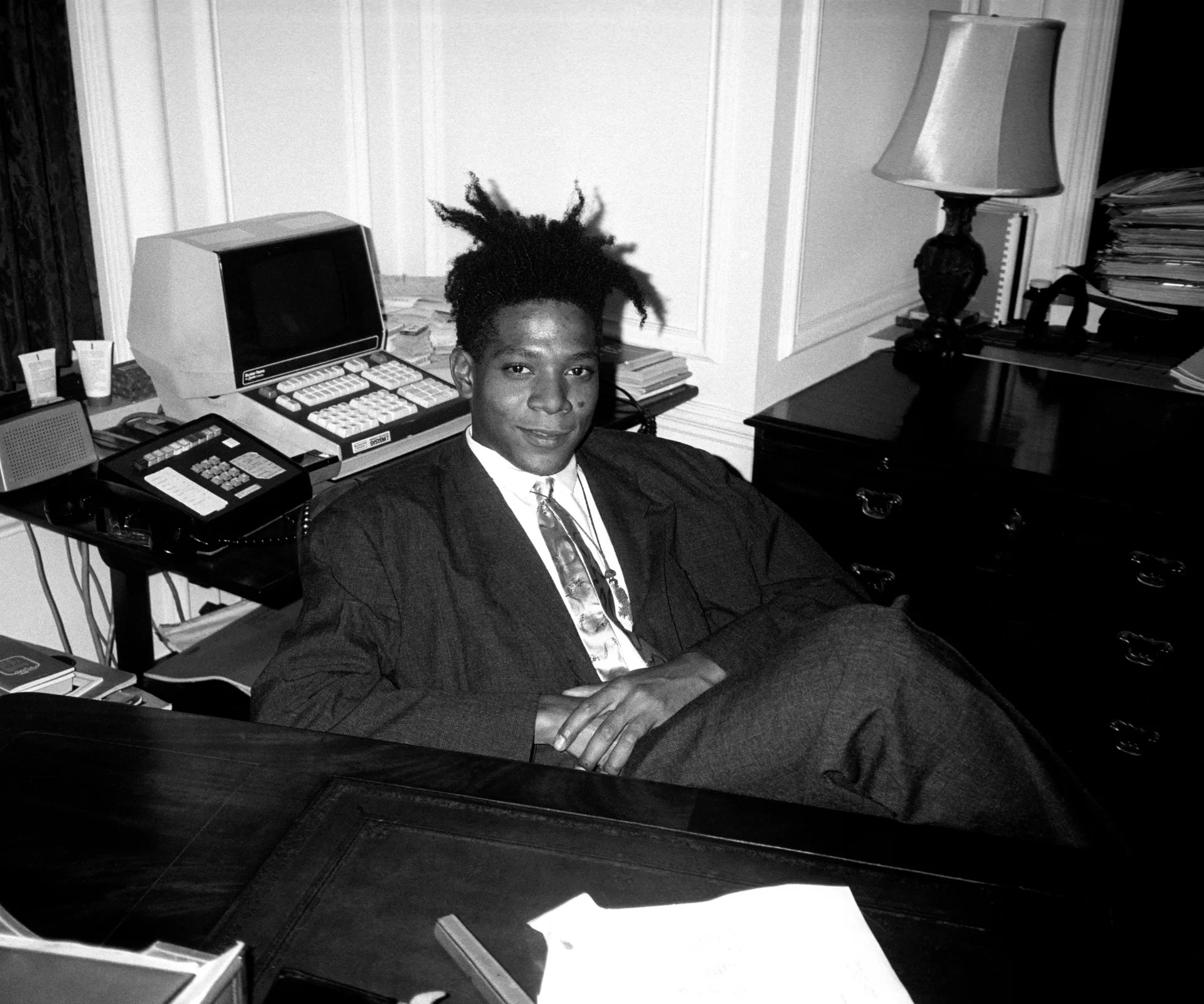 Jean - Michel Basquiat at the surprise birthday party for Susanne Bartsch at the Rainbow Roof, at Steven Greenberg's office, 30 Rockefeller Plaza. Thursday, September 19, 1985. (Photo by Patrick McMullan/Getty Images)
