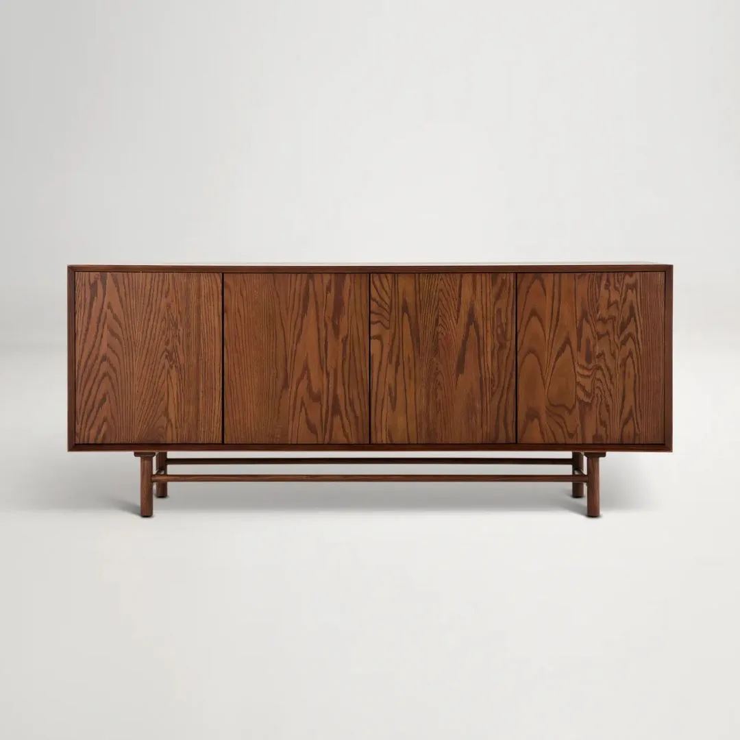 Low walnut timber side cabinets in mid century style for shoe storage at entry way