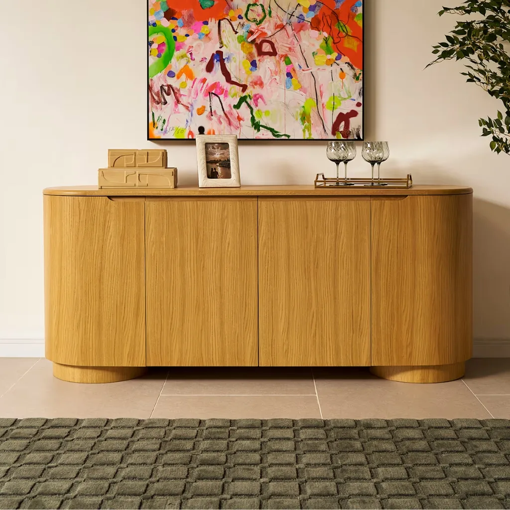 Light timber sideboard with curved edges, minimal detail and no door handles