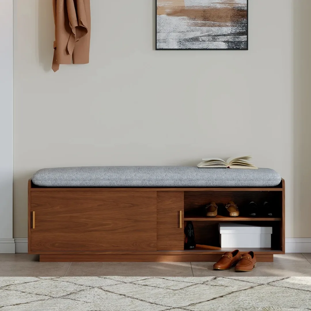 Cushioned walnut storage bench with sliding doors revealing shoe shelf storage