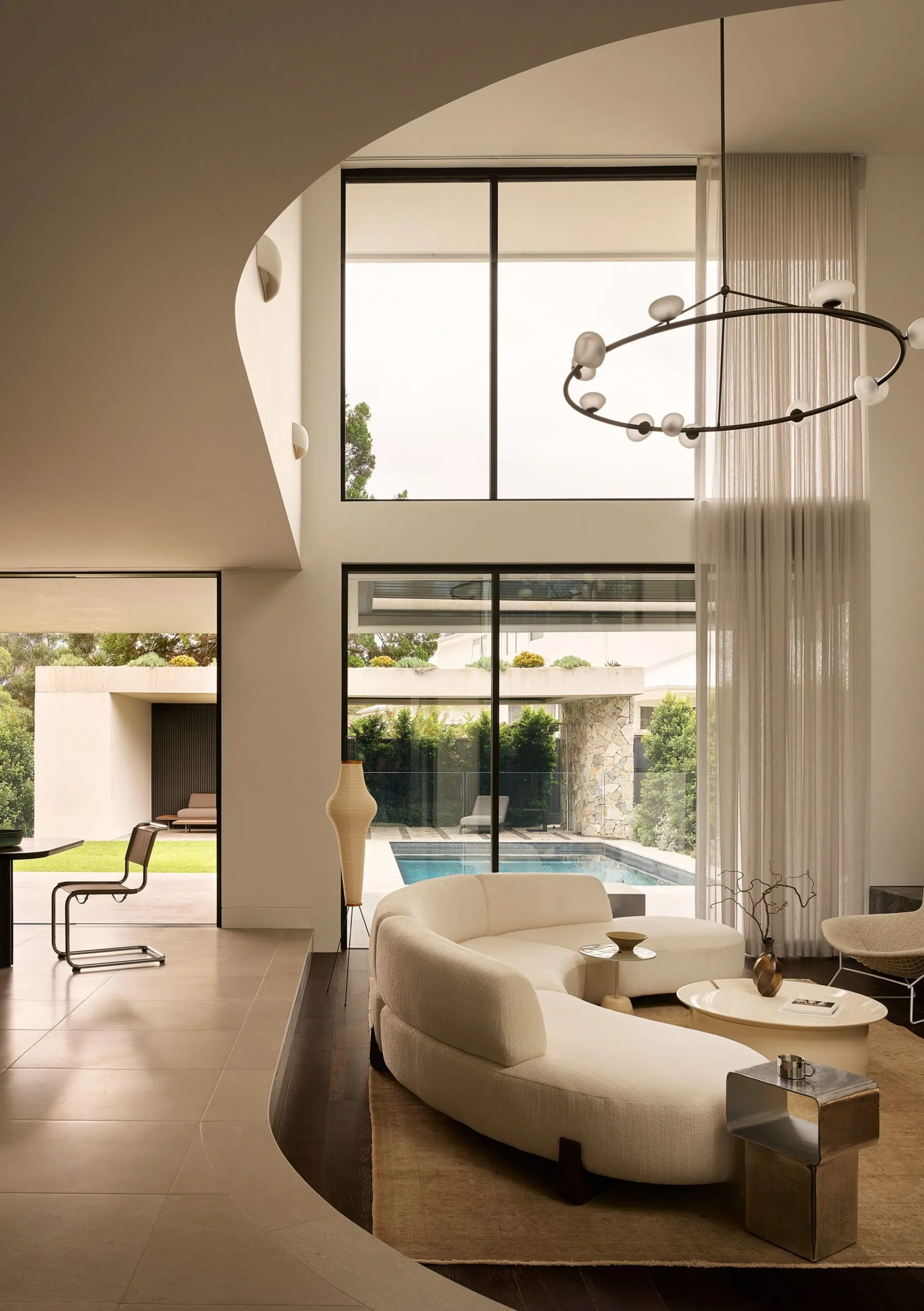 Stanton Beautiful Builds living room beige large windows pool