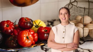 inset image of Laura Sharrad against a backdrop of a kitchen bench covered with heirloom tomatoes