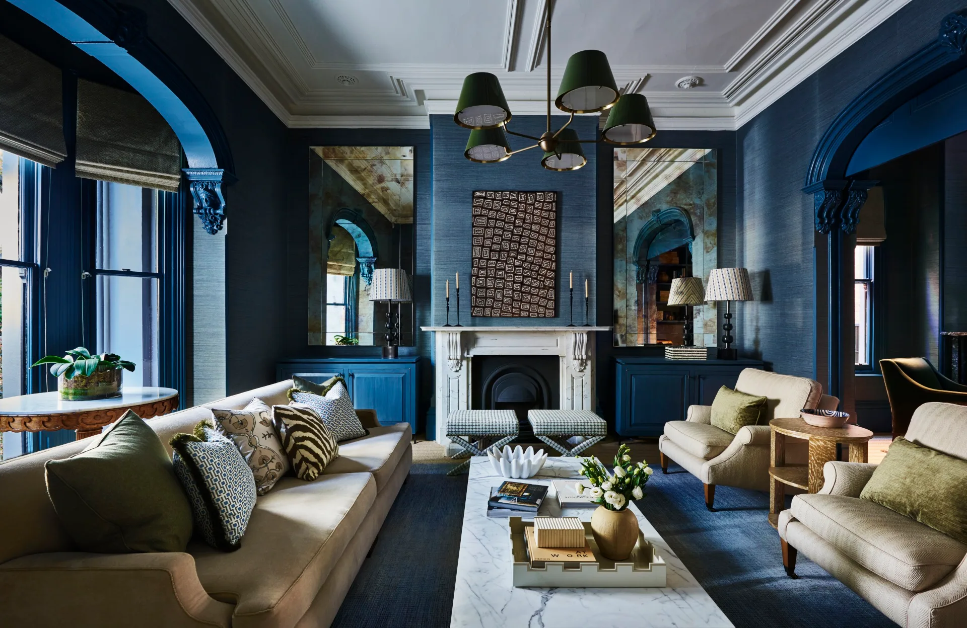 Soothing blue walls, drenched in &lsquo;Surat Sisal&rsquo; wallpaper in Chambray from Jim Thompson Fabrics with Dulux Oceanic trims, deliver a calming and contemporary twist to this Victorian living room in Melbourne. Designed by Adelaide Bragg