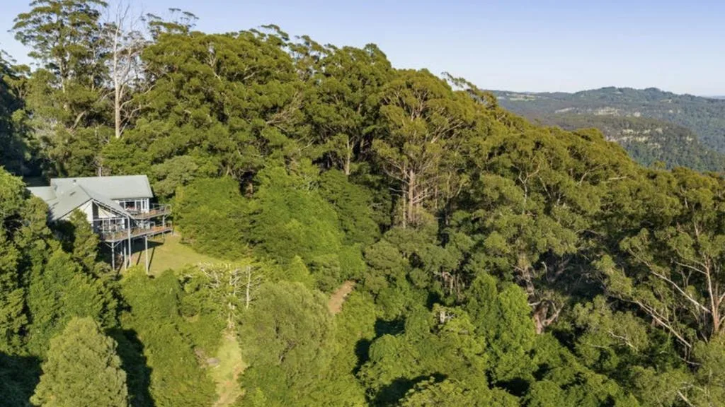 Aerial view of Miriam Margolyes' secluded Southern Highlands property surrounded by rainforest.