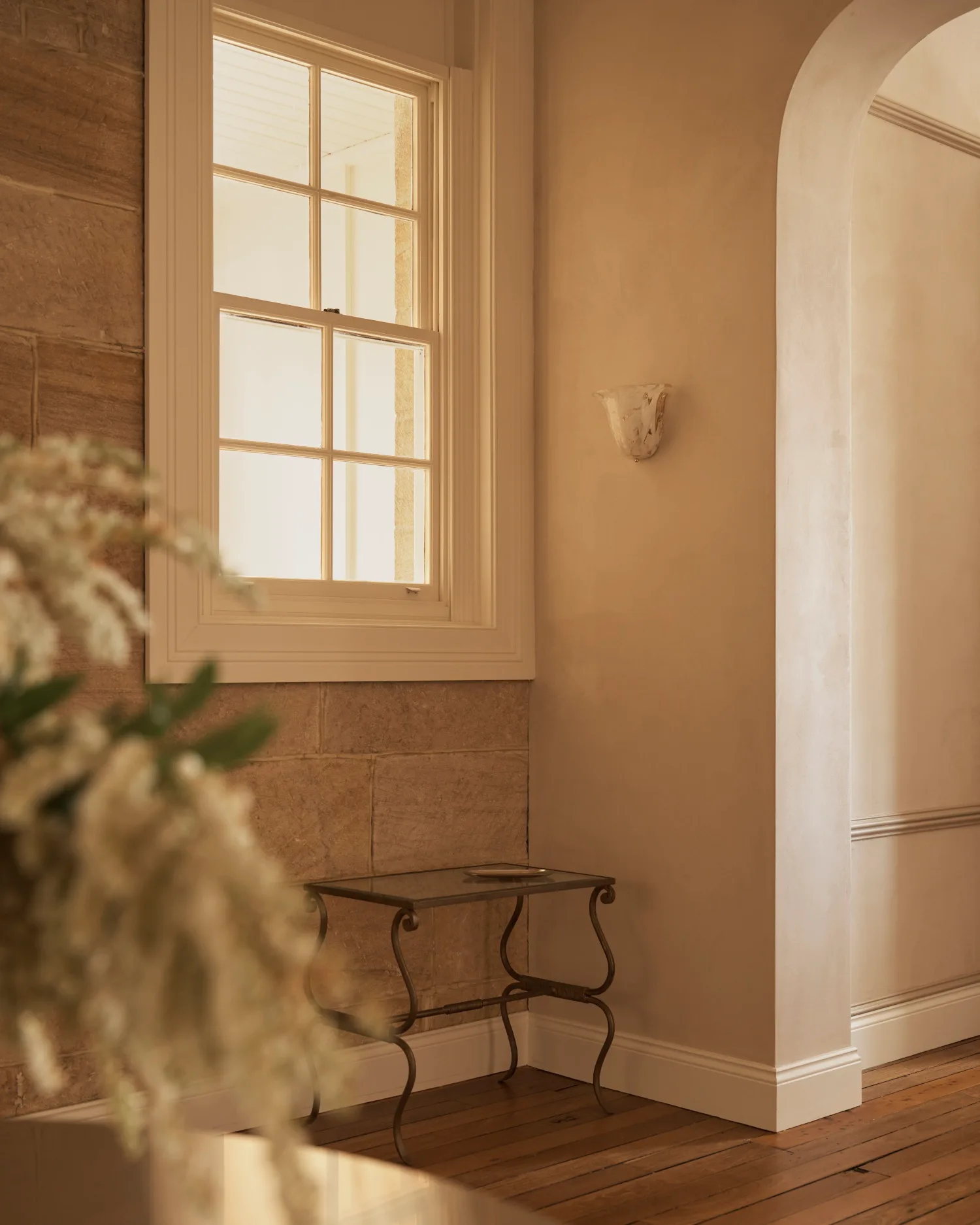 Diandra Politano's studio with table next to sandstone wall