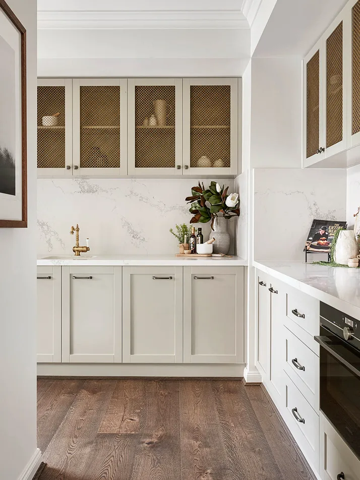 Modern Farmhouse kitchen with metallic mesh cabinetry doors by Metricon Homes