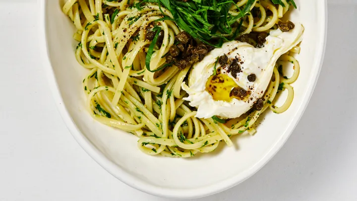 Parsley and pine nut pesto pasta with burrata and rocket