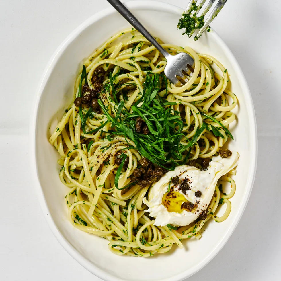 Parsley and pine nut pesto pasta with burrata and rocket
