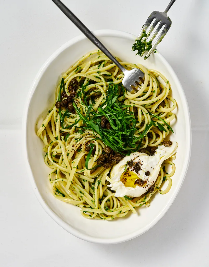 Parsley and pine nut pesto pasta with burrata and rocket
