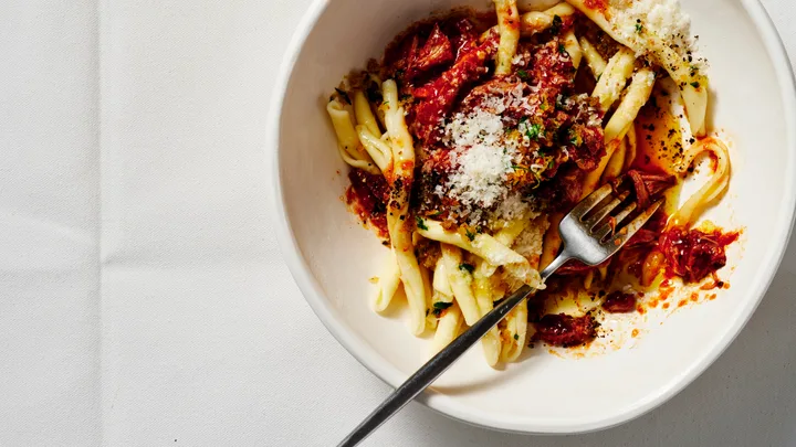 Slow-cooked lamb ragu with mint and anchovy pangrattato