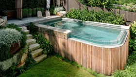 This tricky sloping Sydney backyard was transformed into a lush poolside paradise