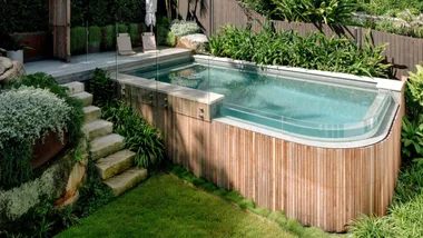 This tricky sloping Sydney backyard was transformed into a lush poolside paradise