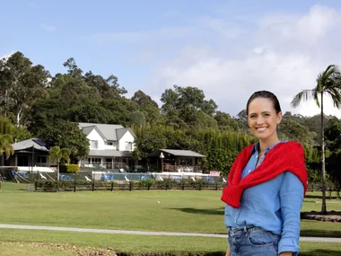 Jesinta Franklin inset with her original home in background