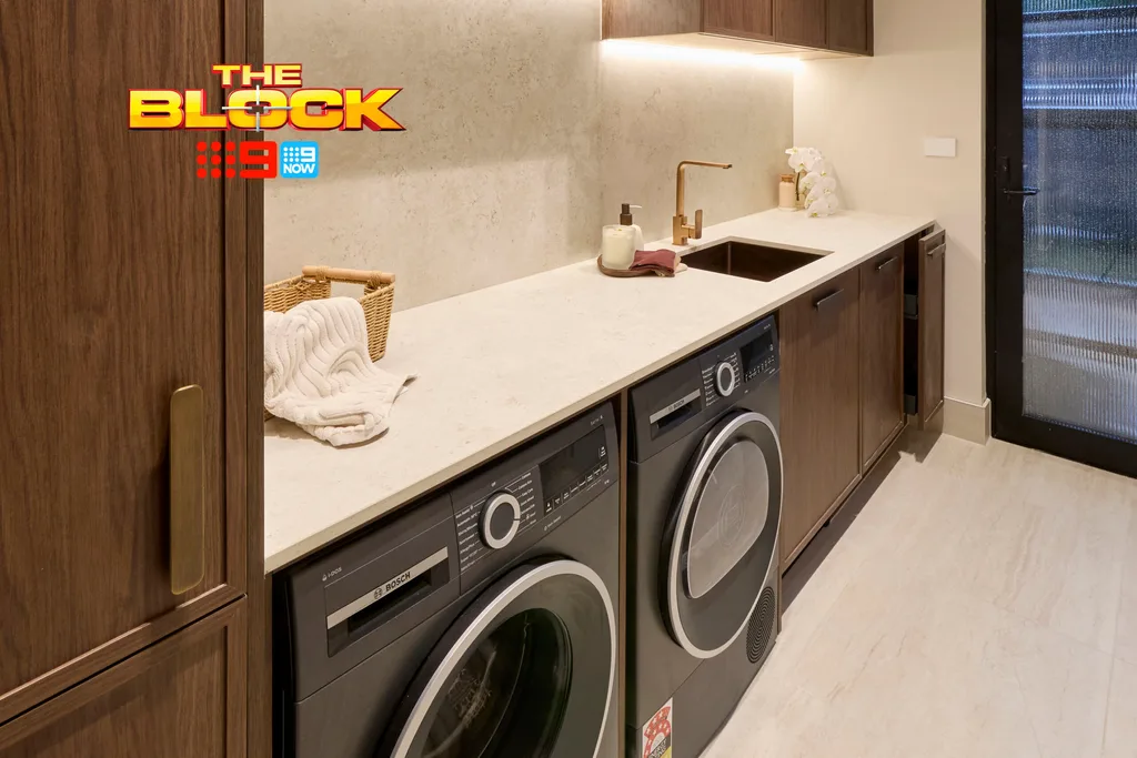 Lisa and Rosco's laundry with dark cabinetry