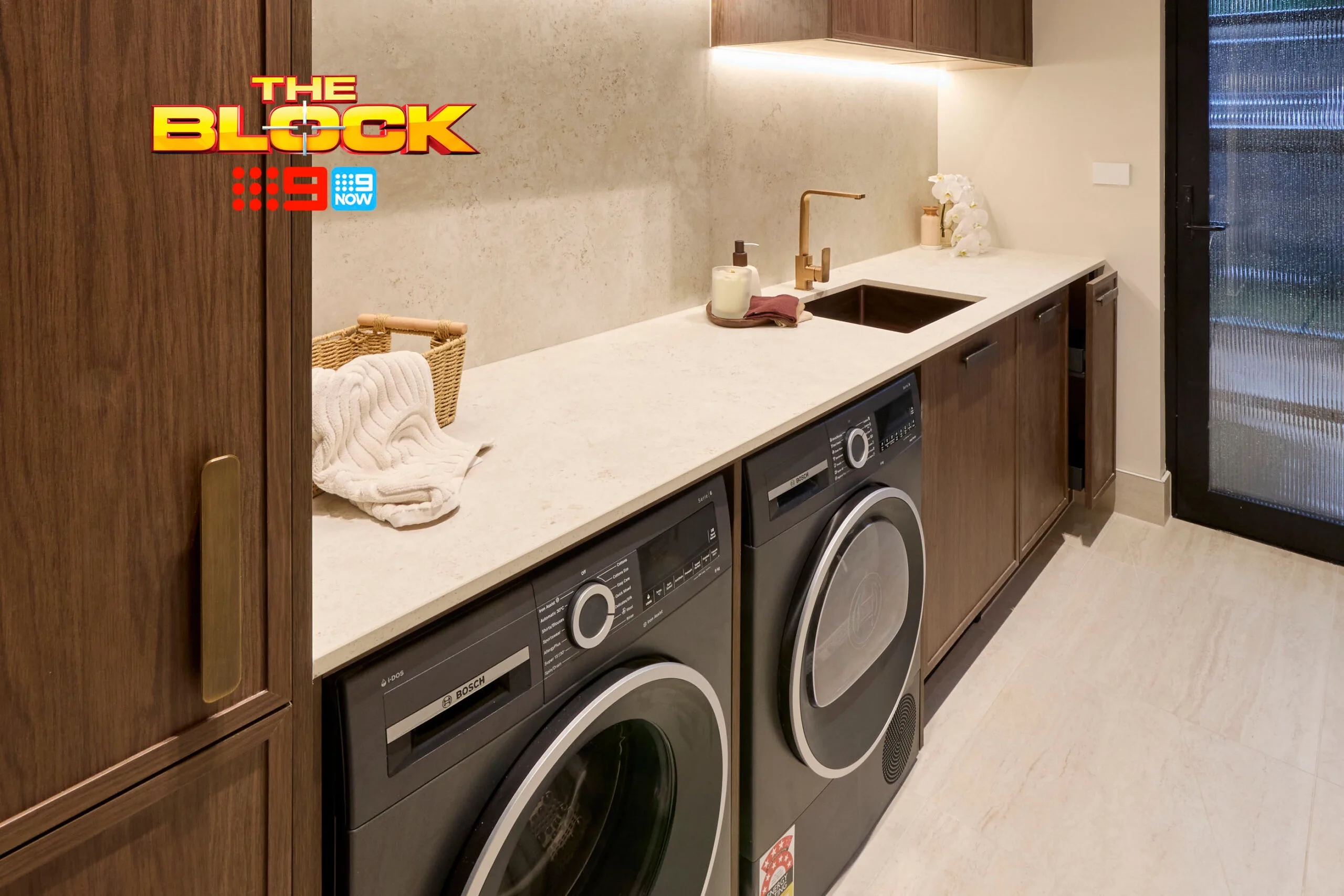 Lisa and Rosco's laundry with dark cabinetry
