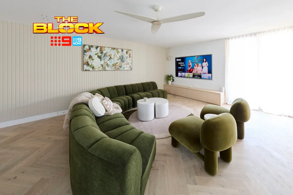 Tayla and Rick's rumpus with green curved couches and armchairs