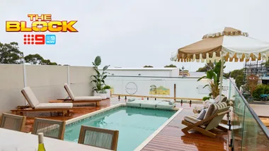 Rooftop deck with pool, sun loungers, and umbrella from "The Block" on 9Now.