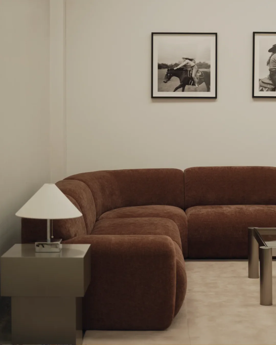 A moody contemporary living room with a rust coloured modular sofa from McMullin