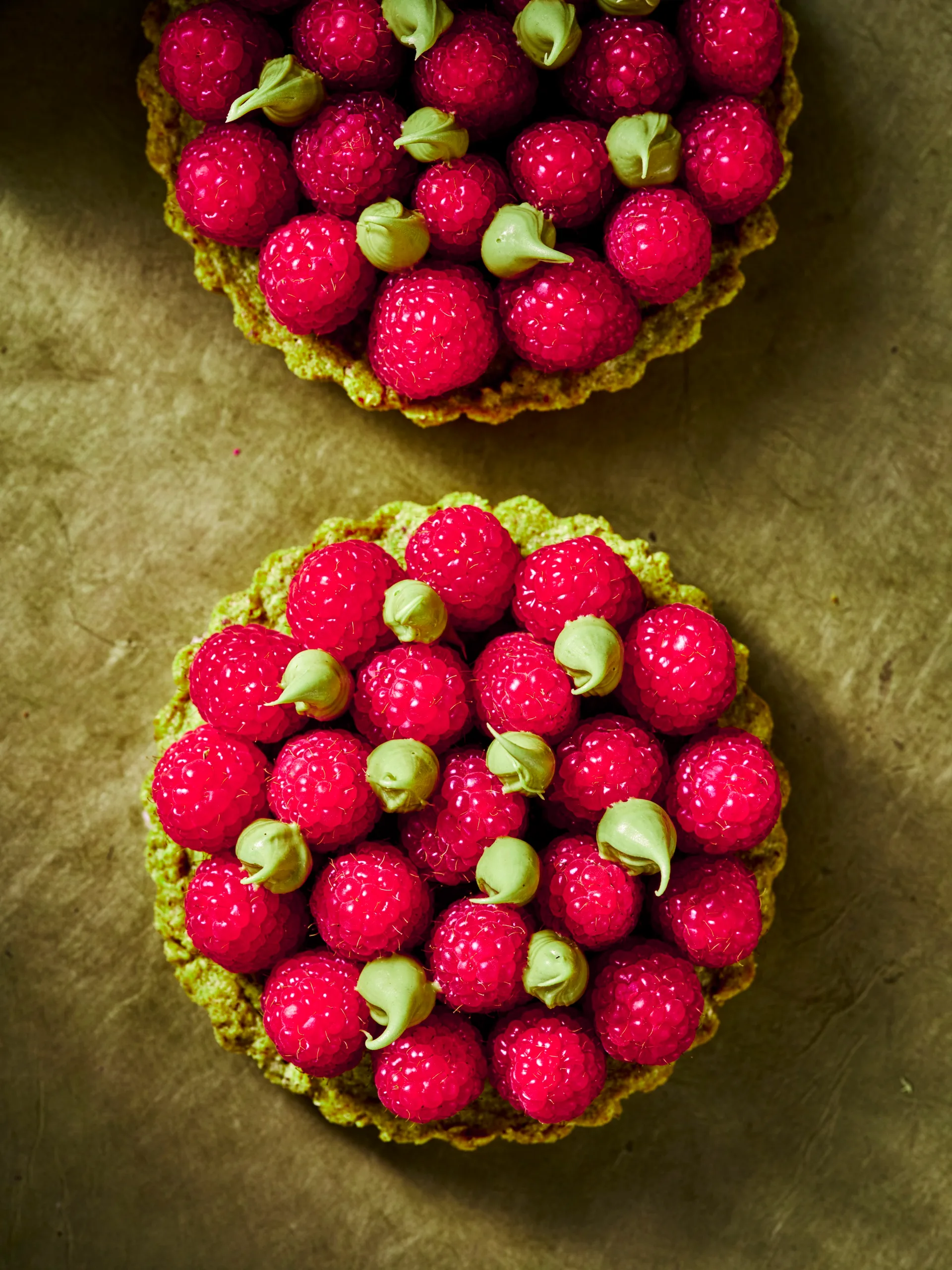 Pistachio and raspberry tarts - full image