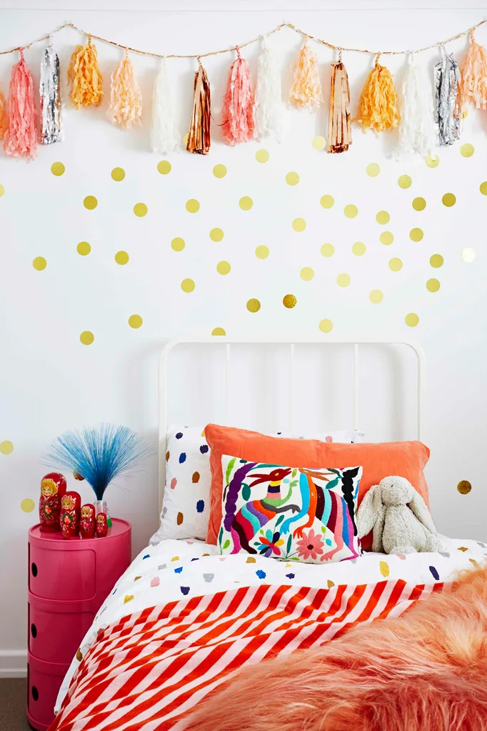 Kids bedroom with Confetti System tassels and gold dots on wall