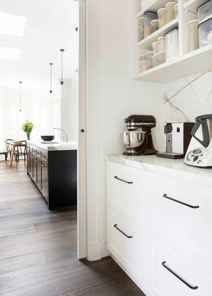 Marble and monochrome kitchen with butler's pantry