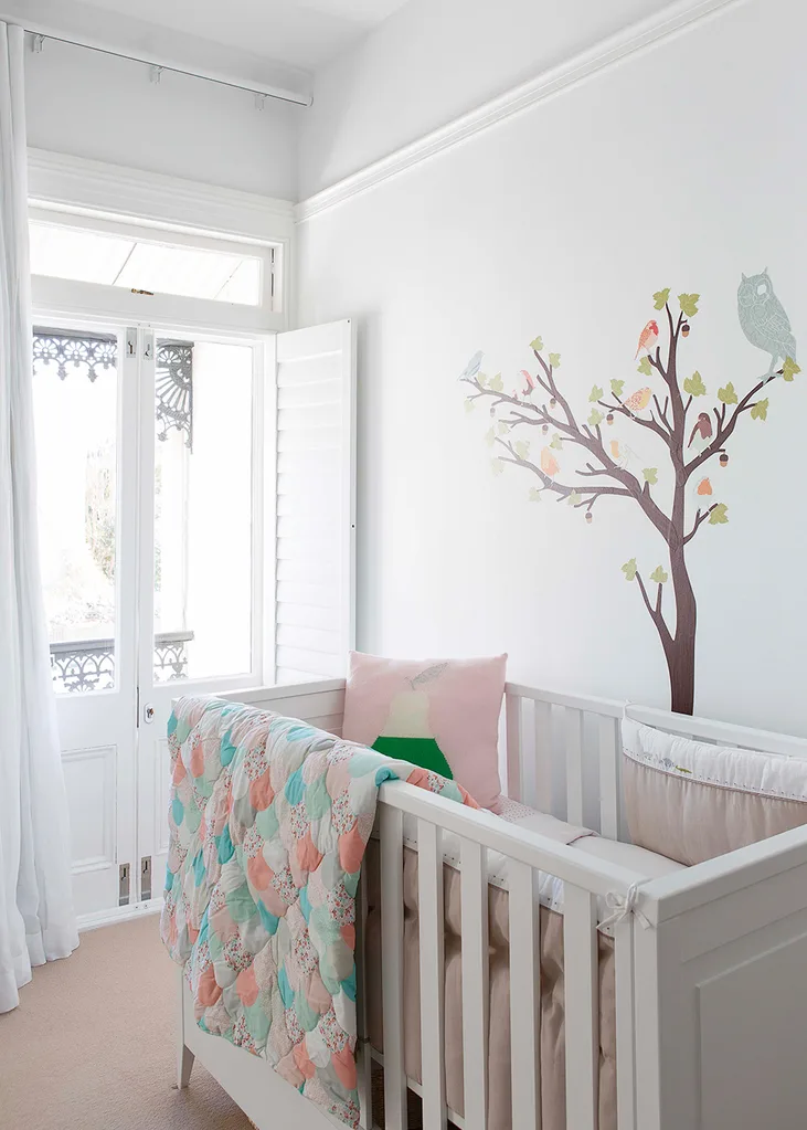 Baby's room with mural on wall