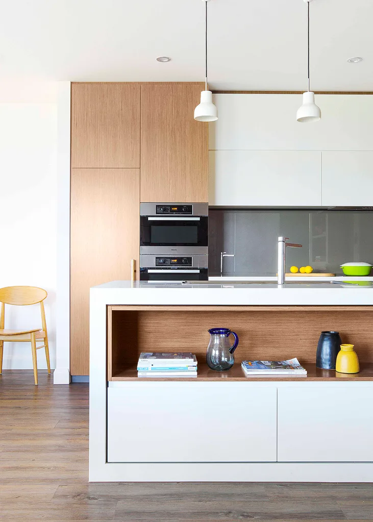 Integrated kitchen with oak veneer panelling