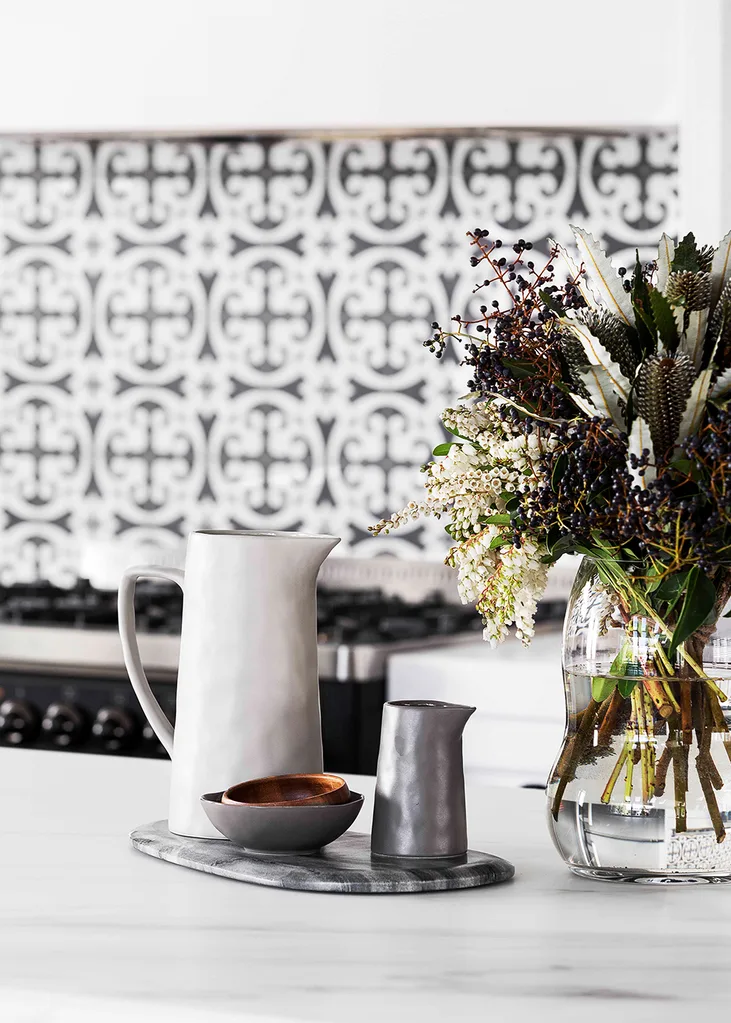 Black and white Shaker style kitchen with marble benchtops