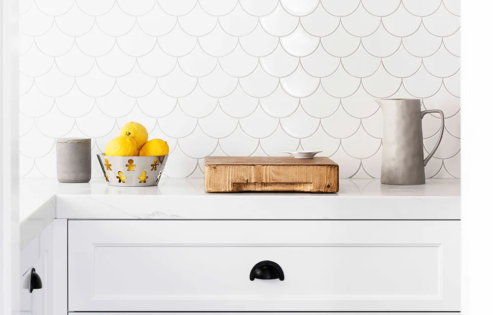 Black and white kitchen with white scale tiles