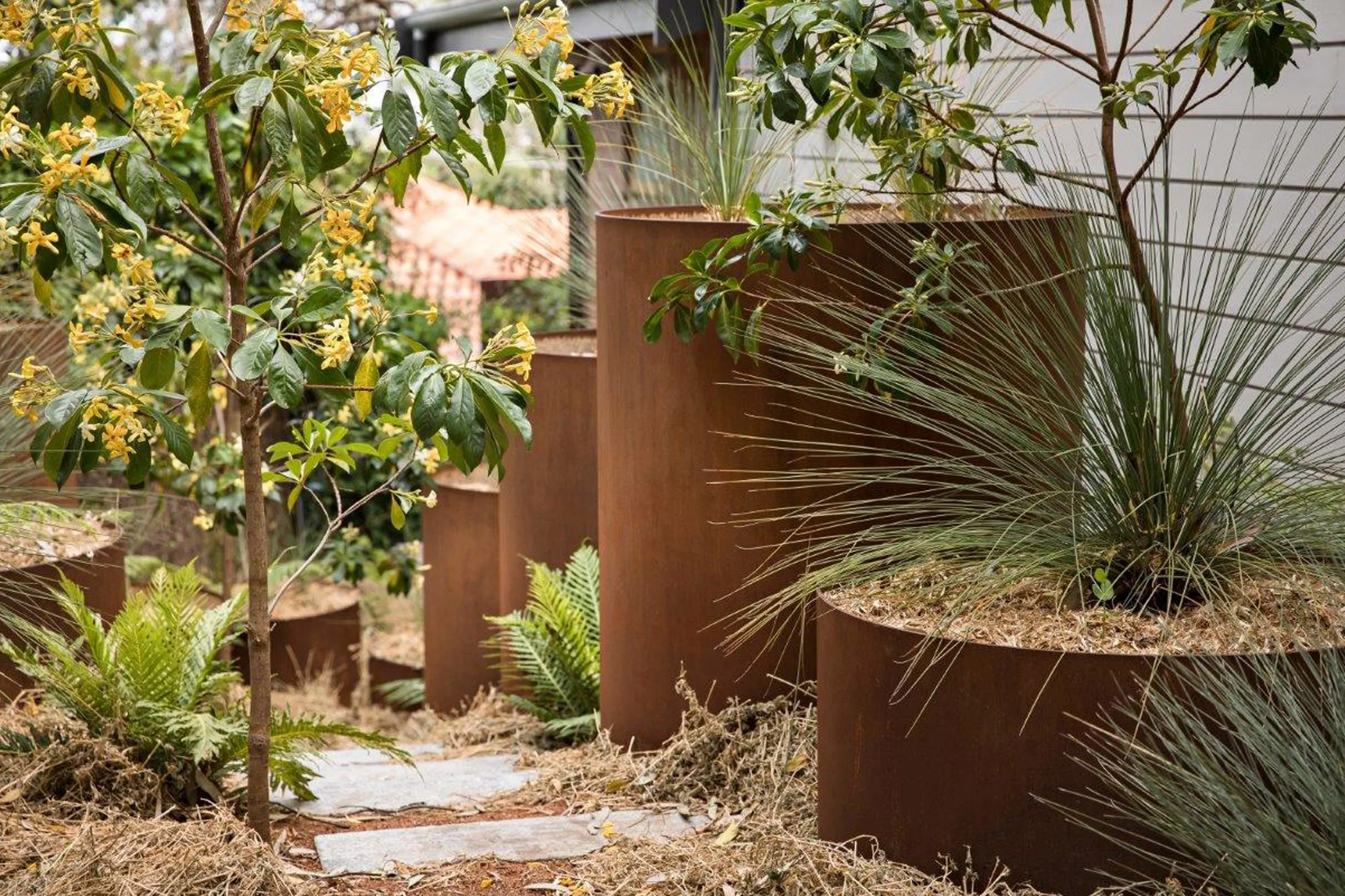 Landscape architecture with corten steel planter boxers