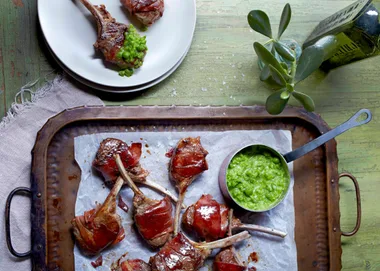 Prosciutto-wrapped lamb cutlets with pea puree