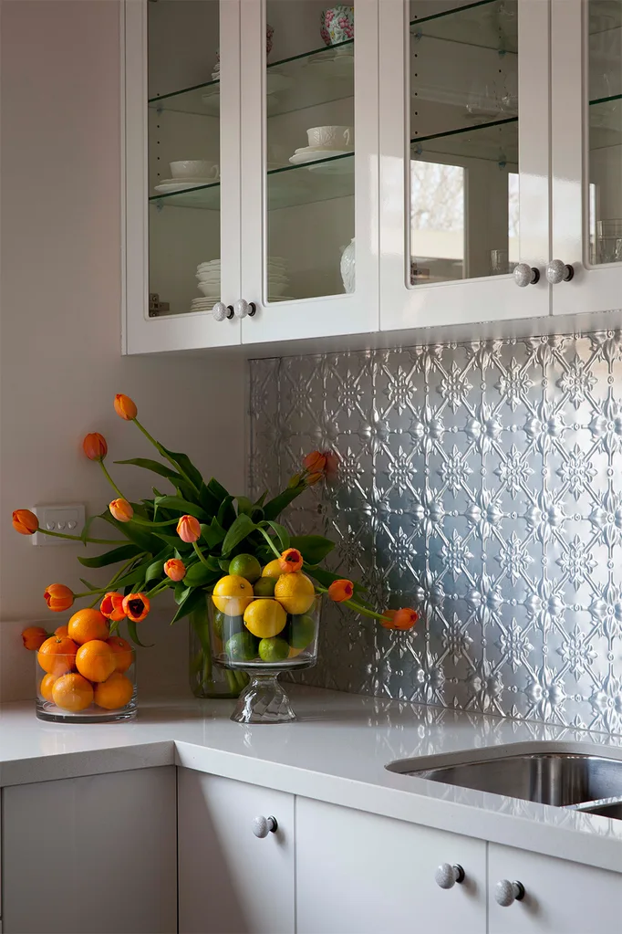 Pressed metal splashback in kitchen