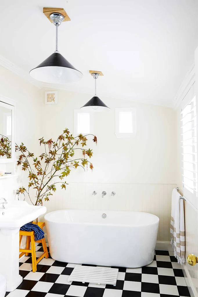 White bathroom with black and white square tiles