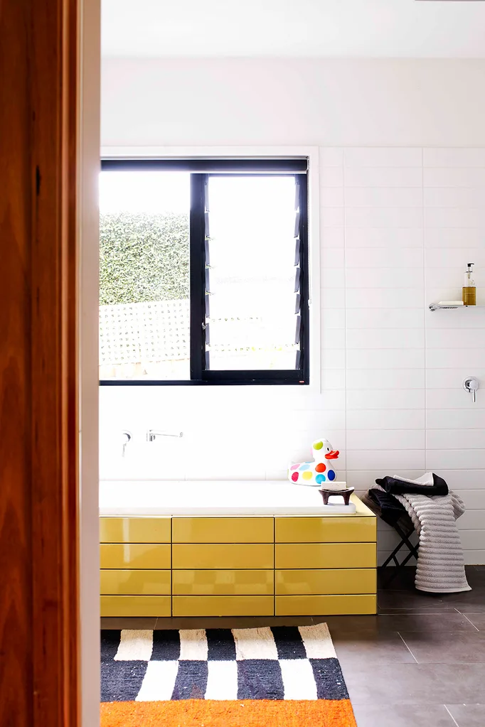 Bathroom with yellow cabinet