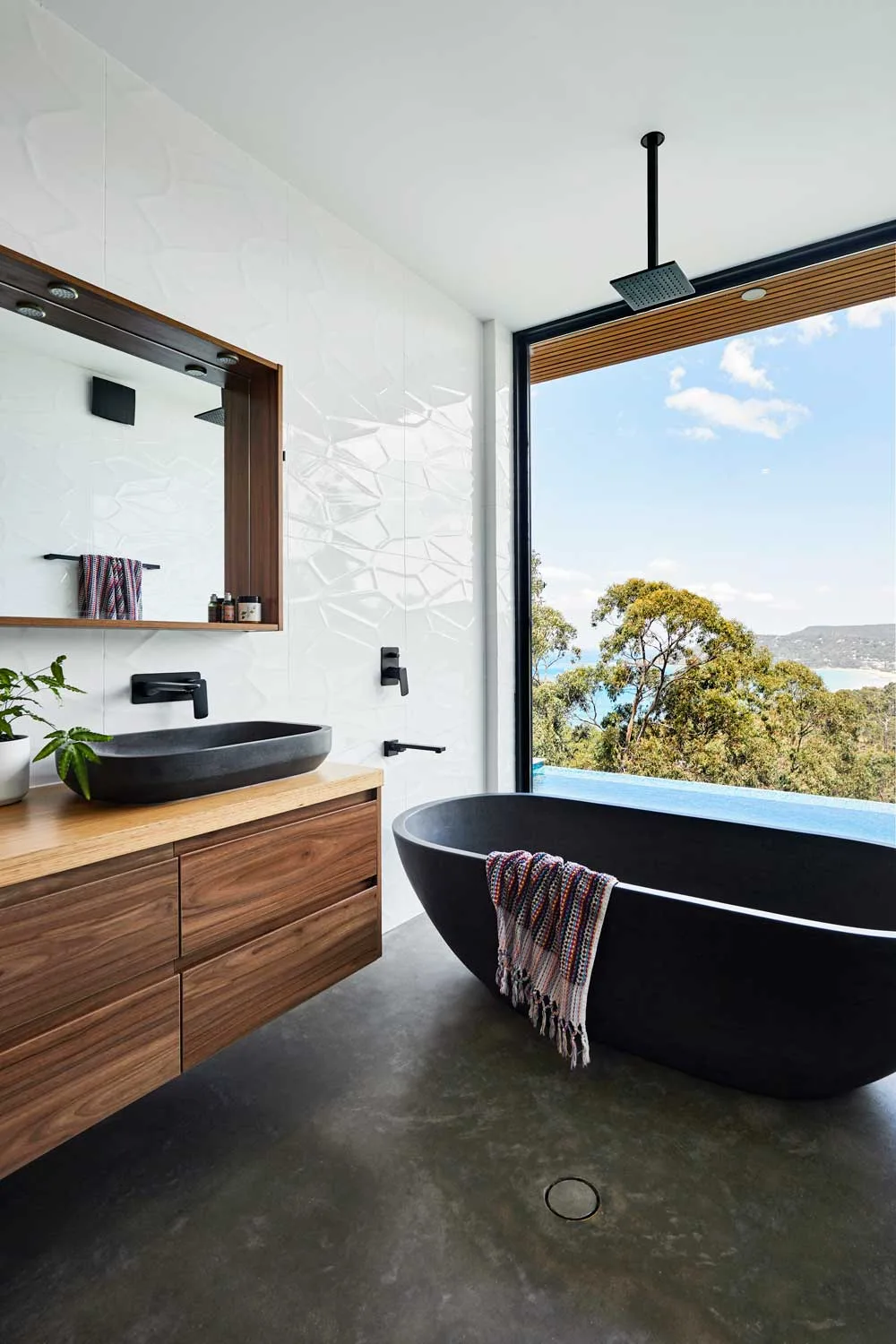 Bathroom with freestanding tub and stunning views