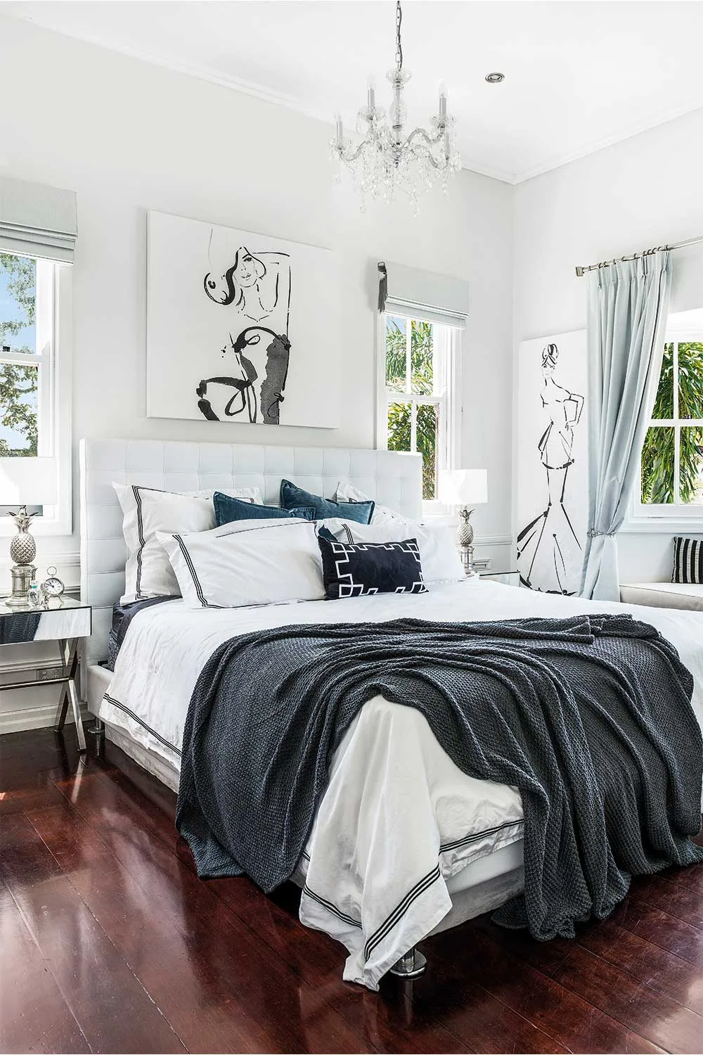 The bedroom of artist Kerrie Hess, featuring artwork above her bed