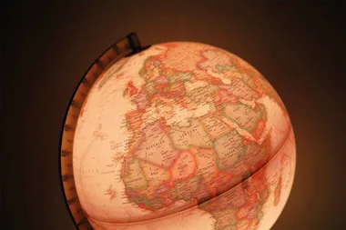 People are upcycling vintage globes into pendant lights, and you’ll love them
