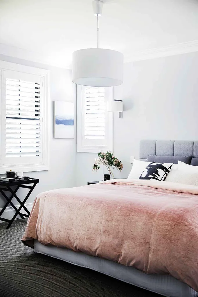 Modern Hamptons bedroom with grey upholstered bedhead and pink velvet doona cover